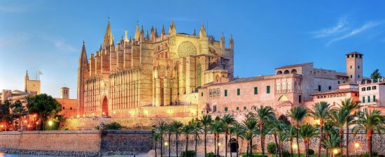 Cathedral of Palma de Majorca reflecting on the water at evening